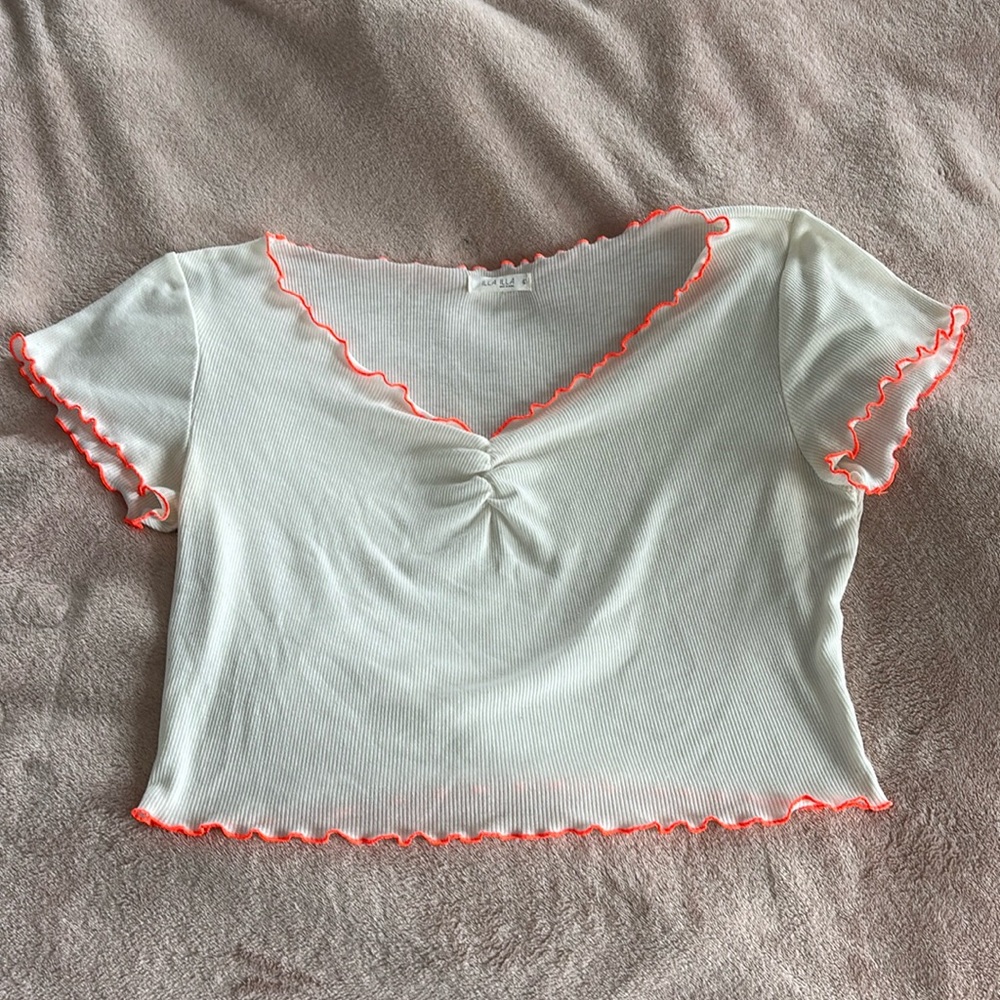 White tee with orange trimming